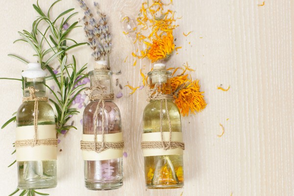 Bottle with herbs and flowers